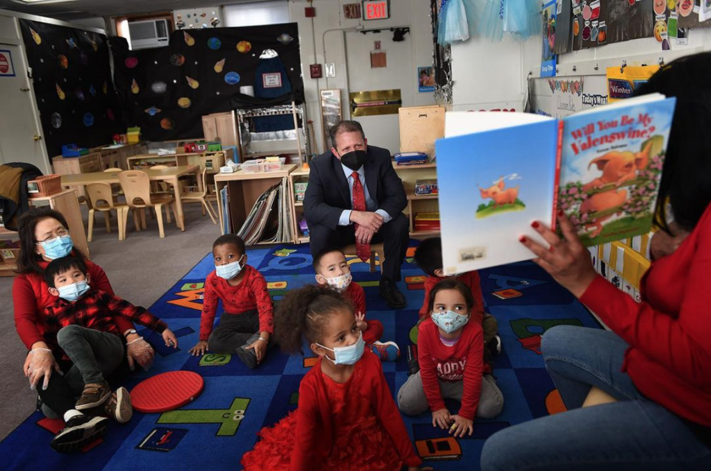 Comptroller Brad Lander listens into a Valentine's story alongside Henry Street Early Childhood learners