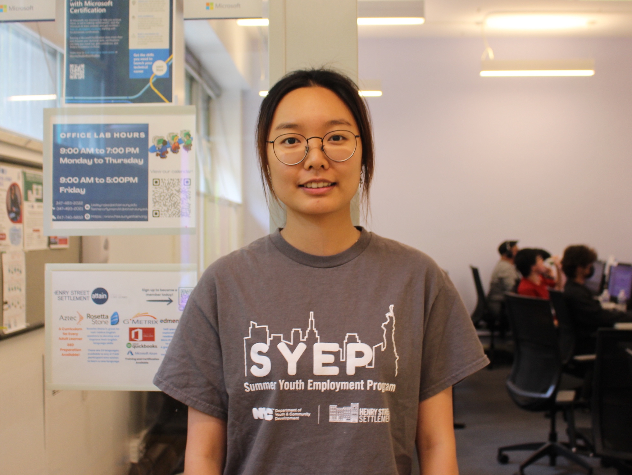 Yu Ying Lai in front of the Attain computer lab