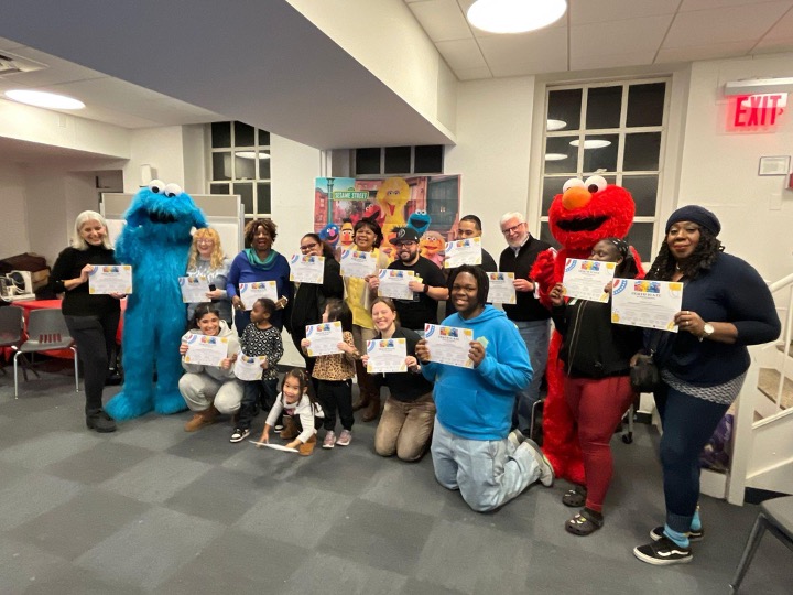 Participants in the mentoring program pose with their certificates