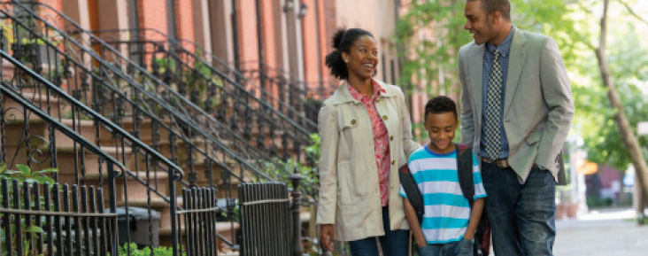 Family walking down street photo