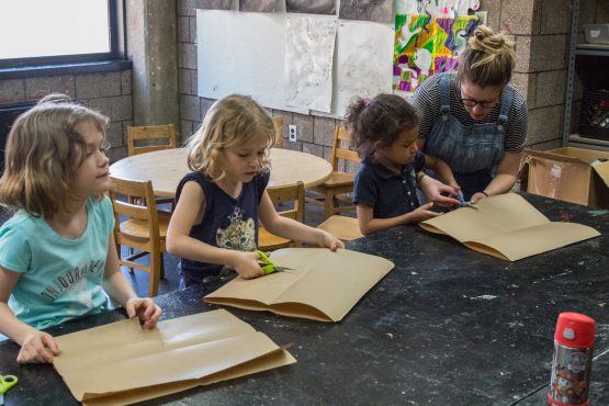 Children take an art class