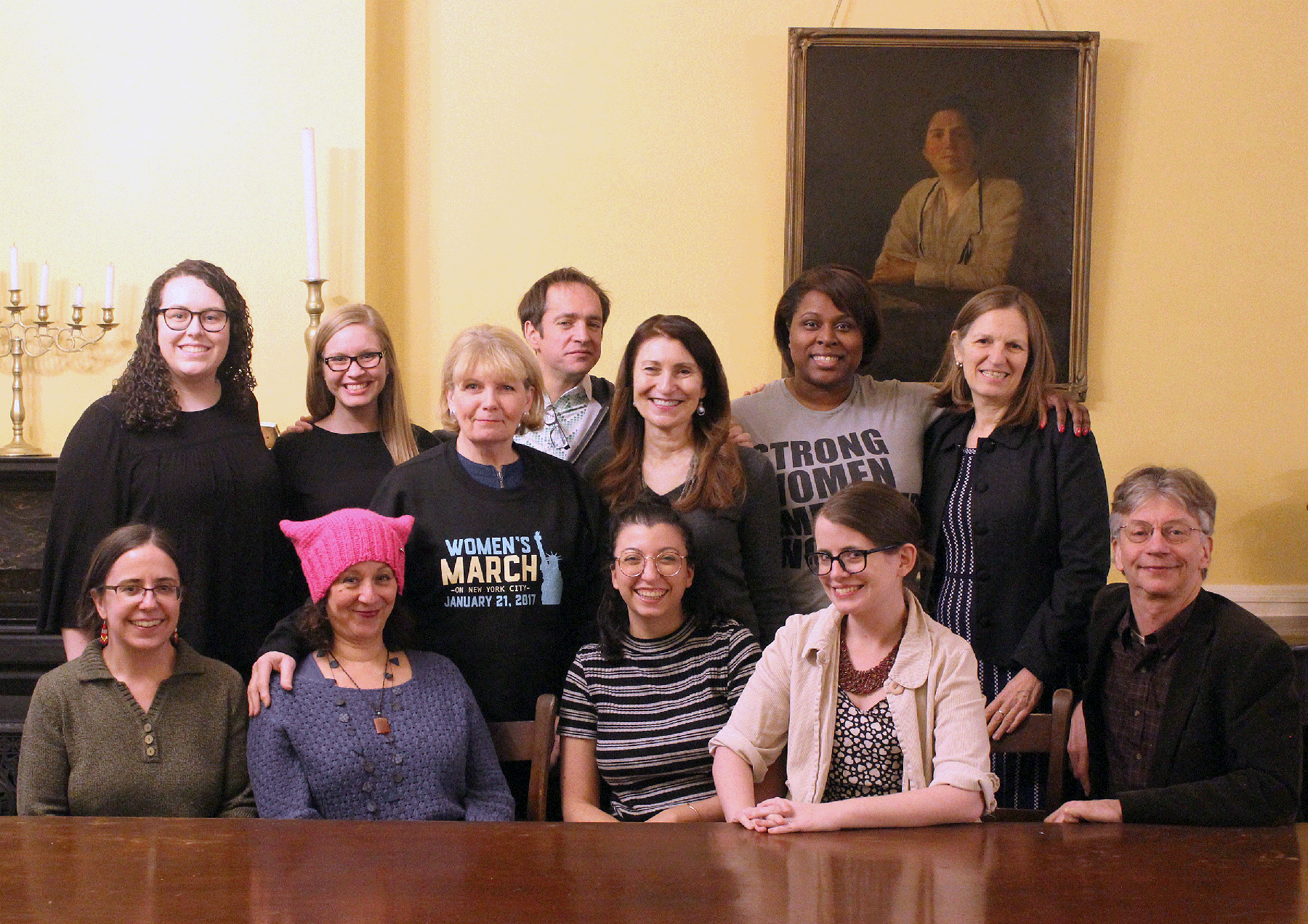 Henry Street team members who attended Women's March 2017 pose and smile at Henry Street headquarters
