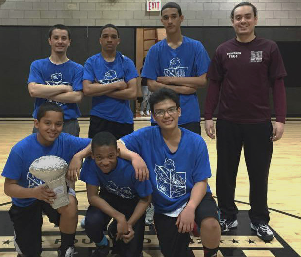 Young basketball players pose for camera