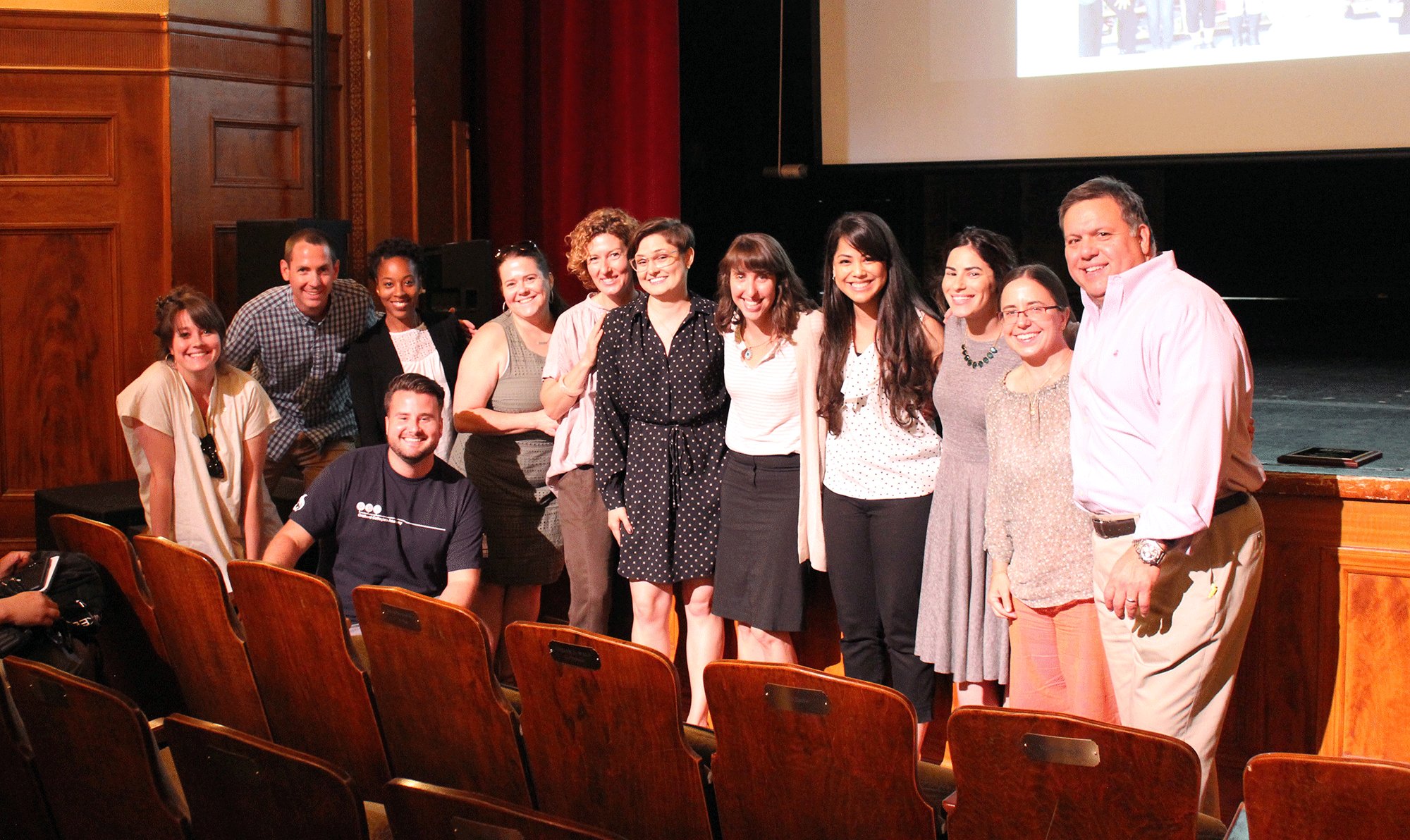 Henry Street team members and David Garza smile for camera