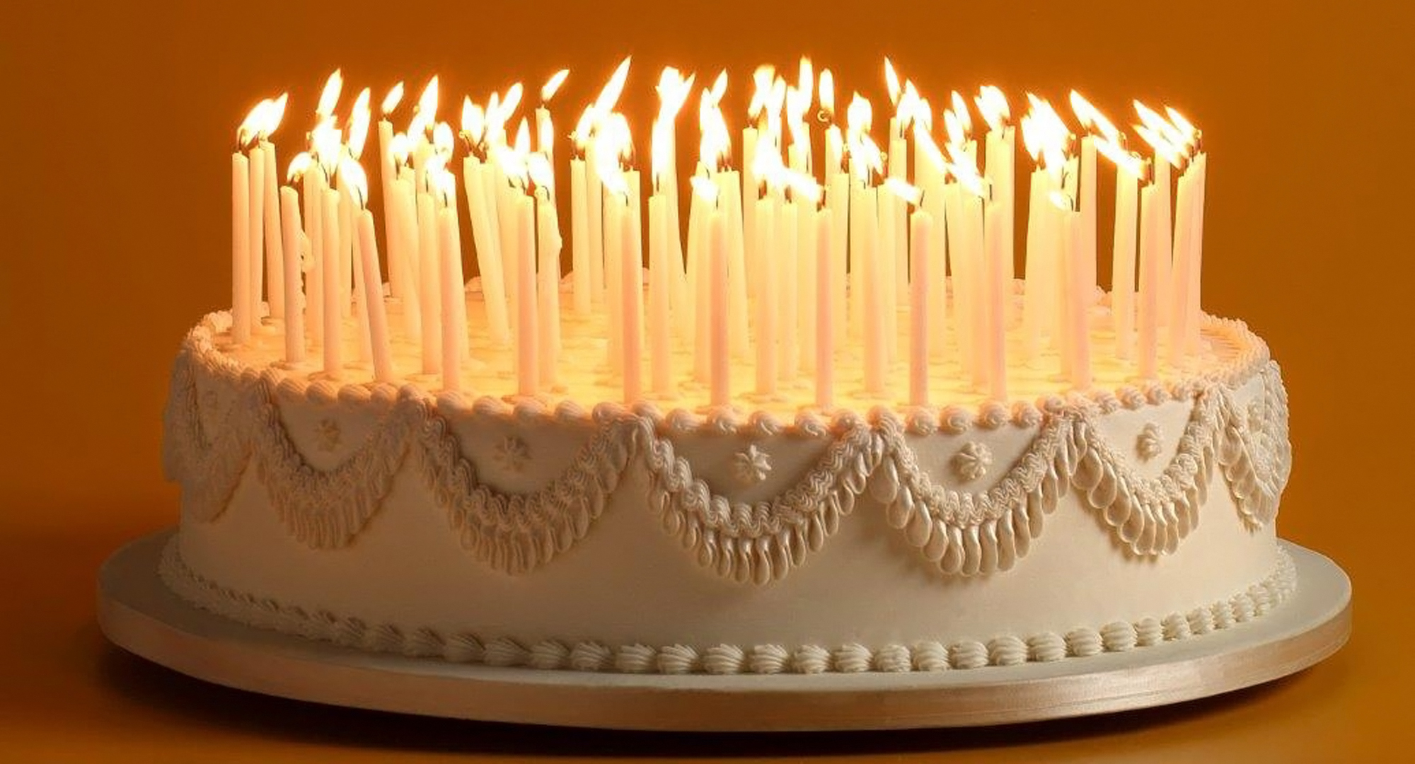 Cake with many candles on it