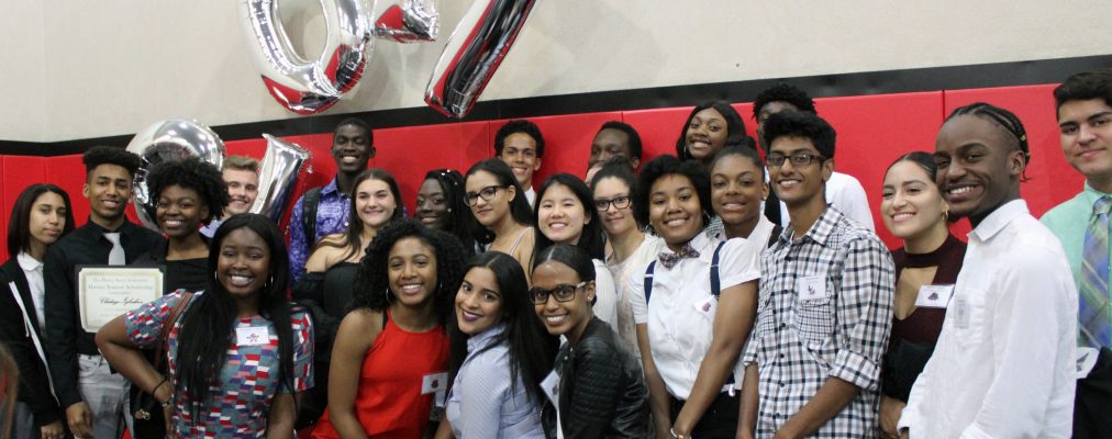 Expanded Horizons youth smile at camera with '2017' balloons