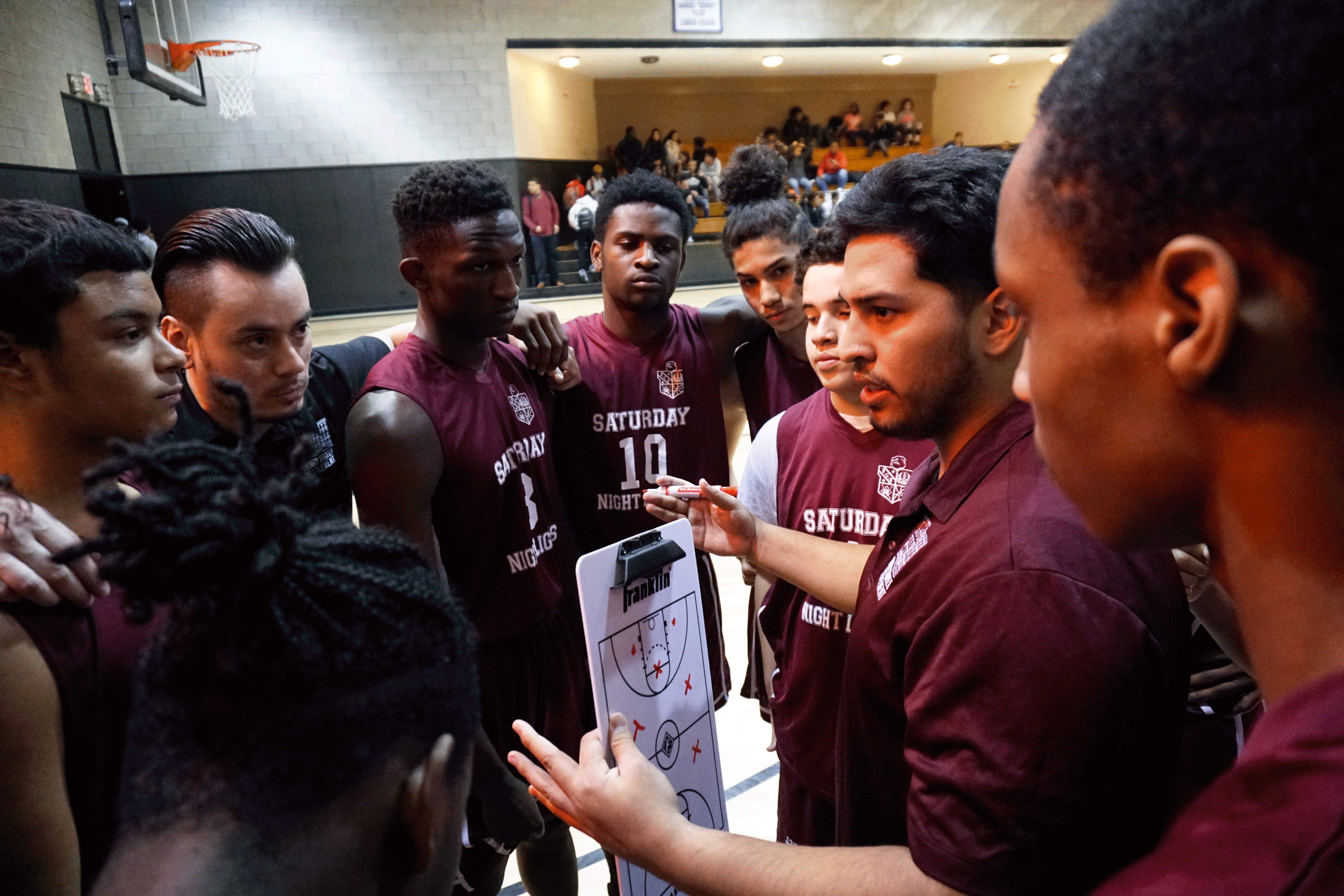 Henry Street youth huddle at one of BGR's SNL basketball games.