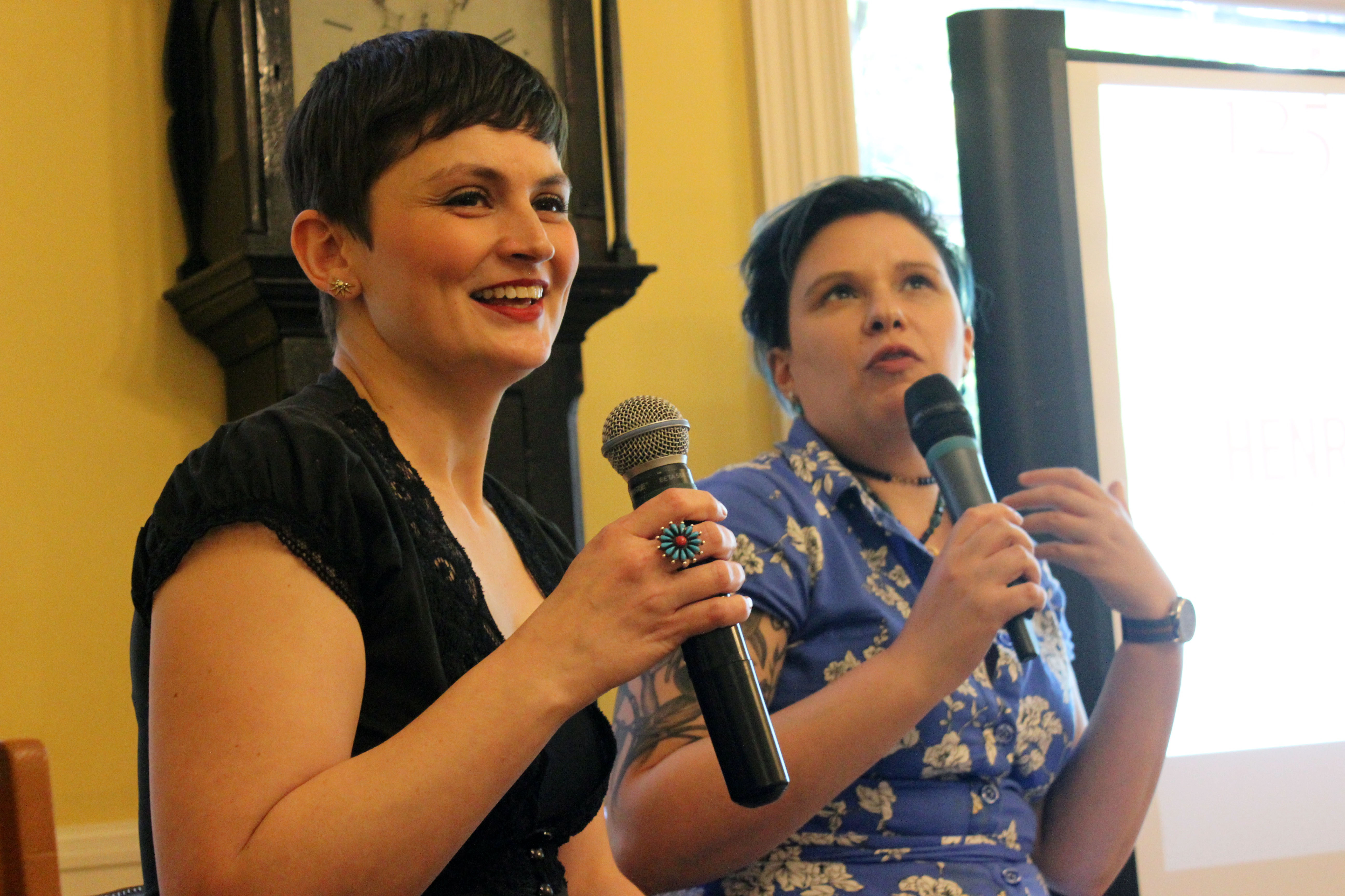 Panelists speak in microphones at Henry Street Settlement