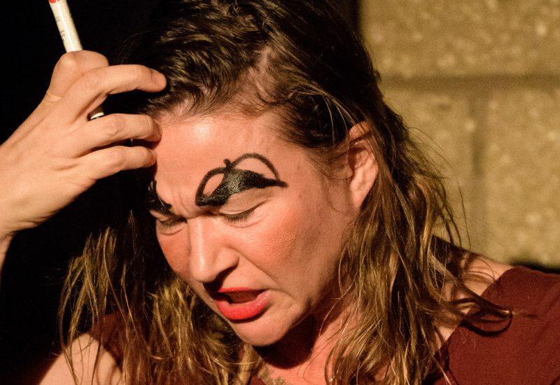 Performance photo of woman in angst (Juliana May)