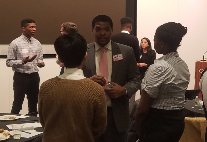 Preston Baker from Valudi Capital engages in conversation with two Expanded Horizons participants during the networking dinner