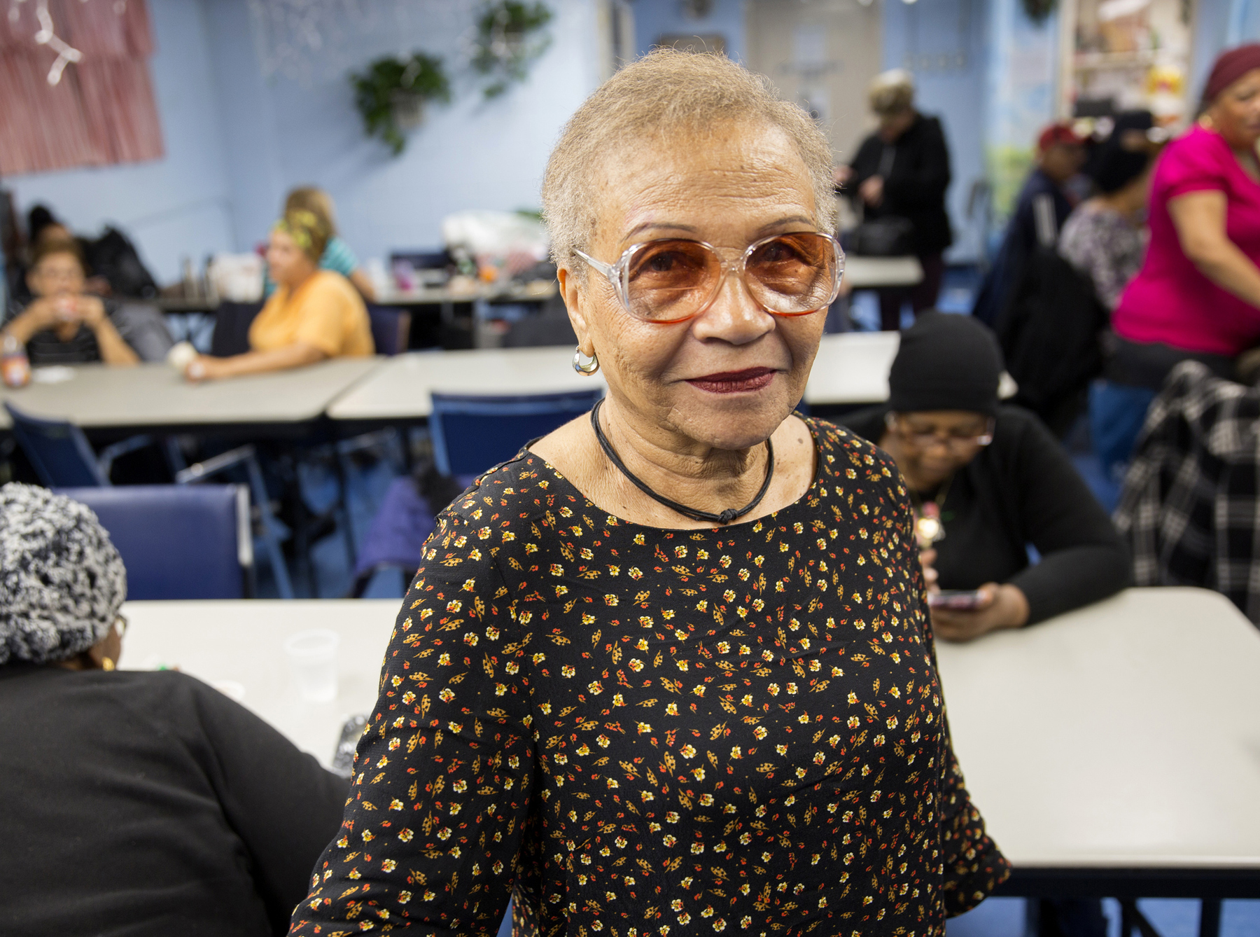 Smiling senior woman in senior center