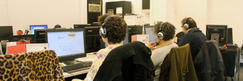 Adults at computers in computer lab