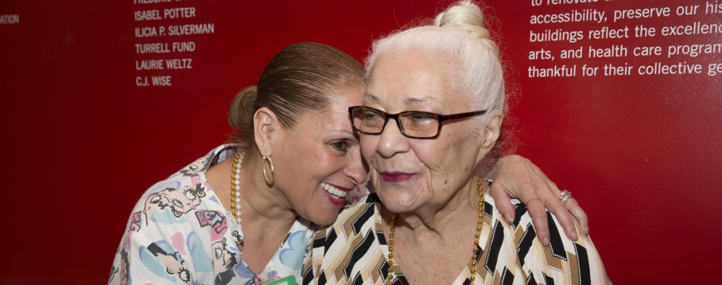 Two elderly women hugging