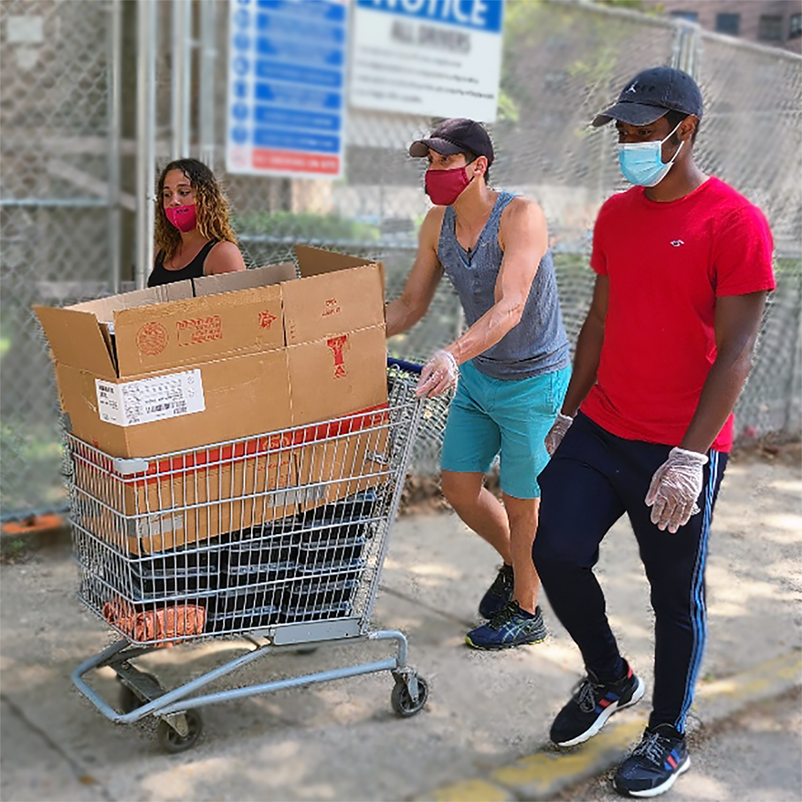 Three youth employees of the LES Mobile Market training for their delivery jobs by pushing a cart of food in the Baruch Houses.