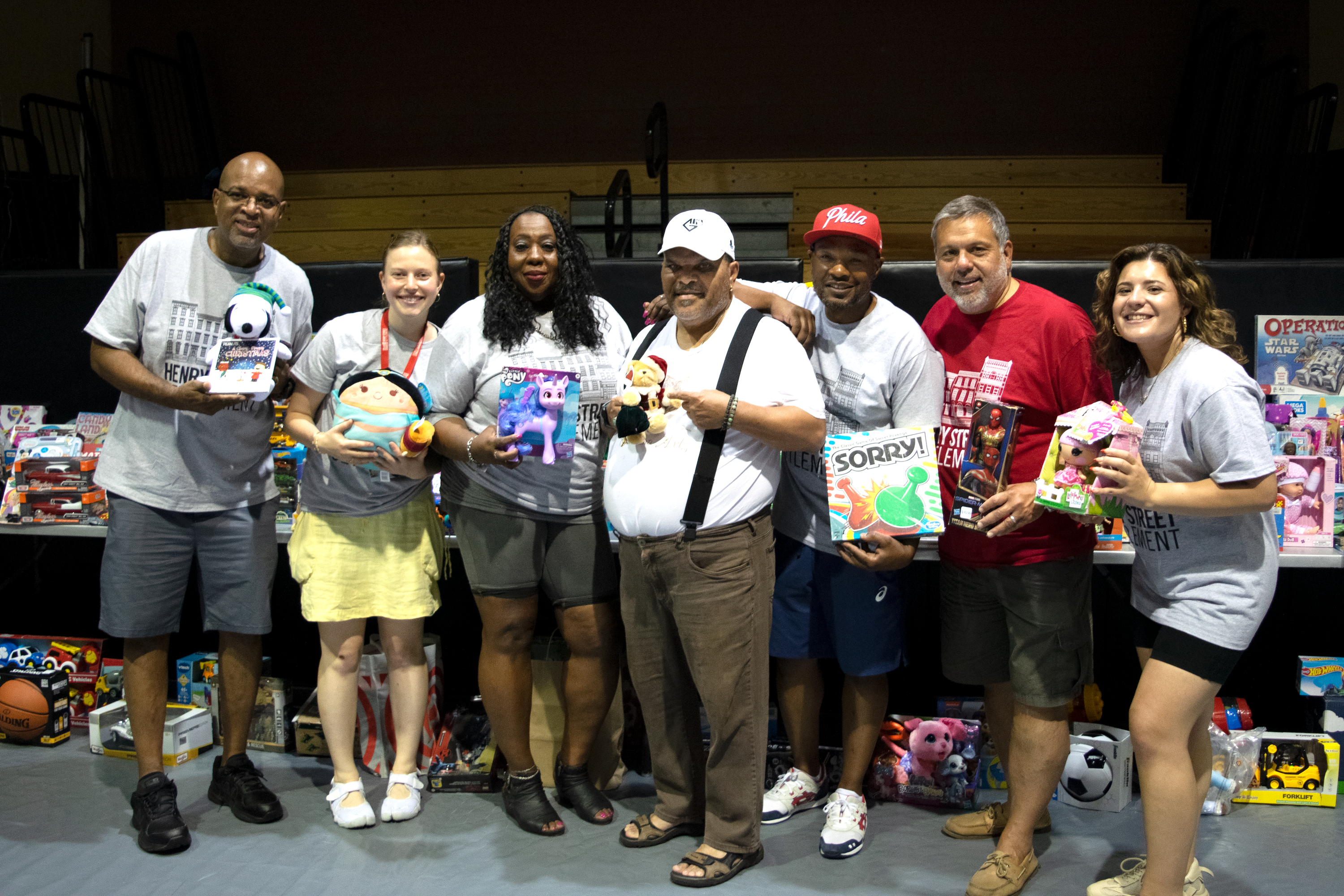 Photo of 7 adults holding toys