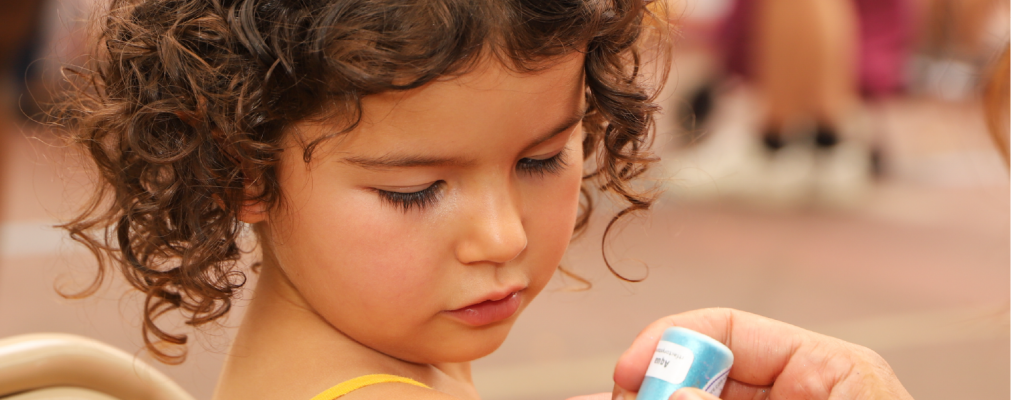 Child getting her arm painted