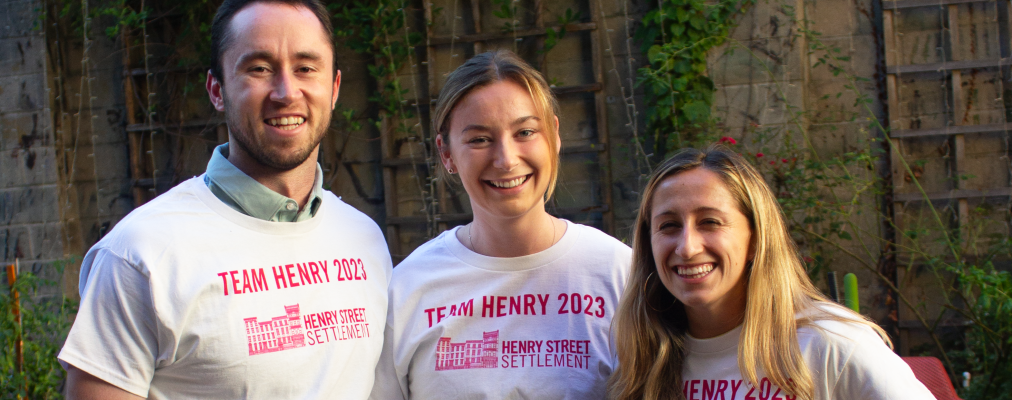 Three NYC Marathon runners wearing white shirts that read 